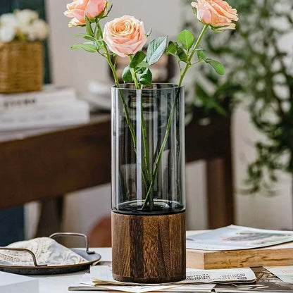 Round Wooden Vase on a table next to decorative elements