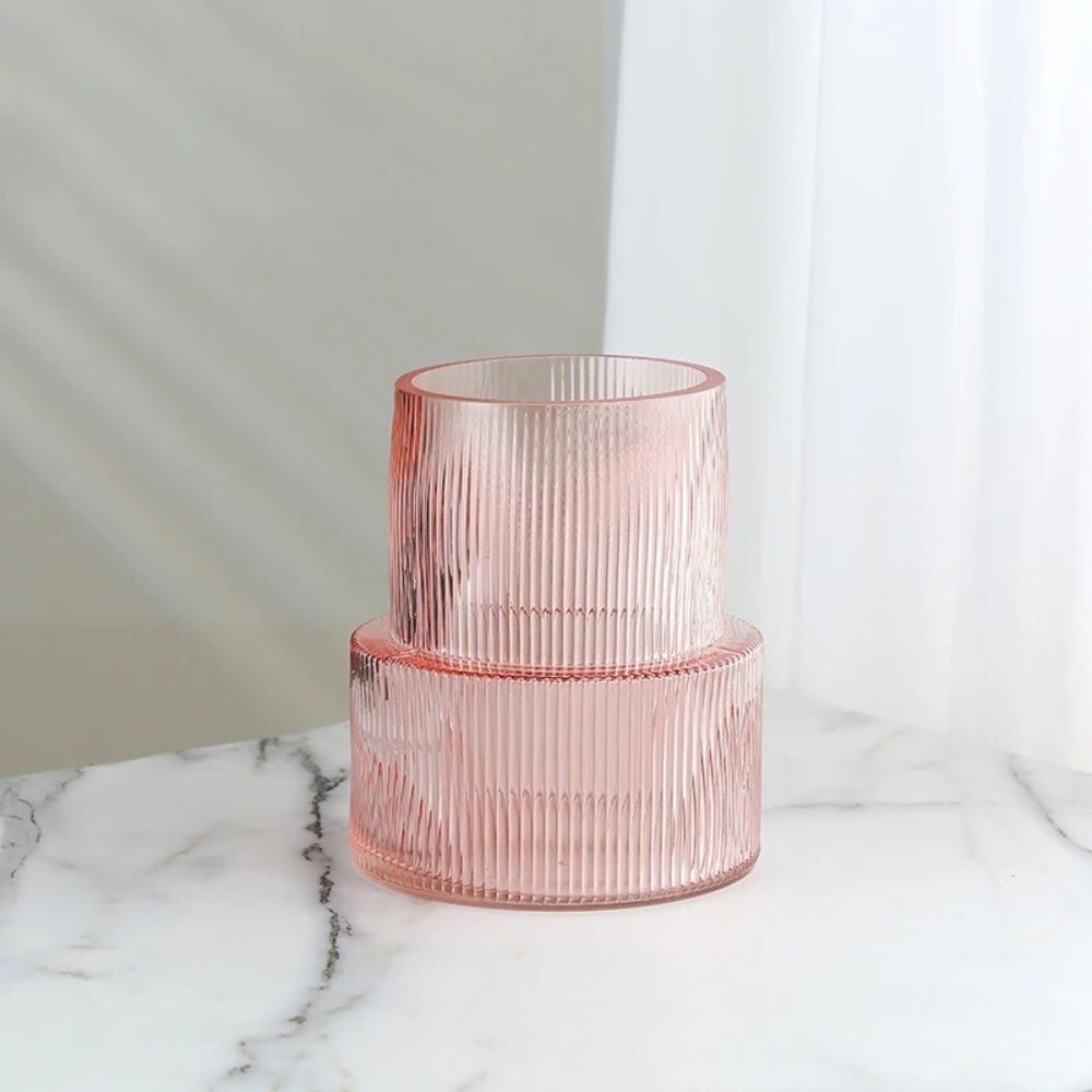 Short Cylinder Vase in pink on a white marble table