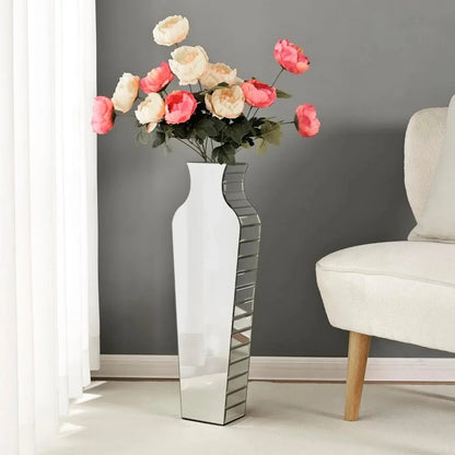 Silver Floor Vase facing backwards with red roses inside