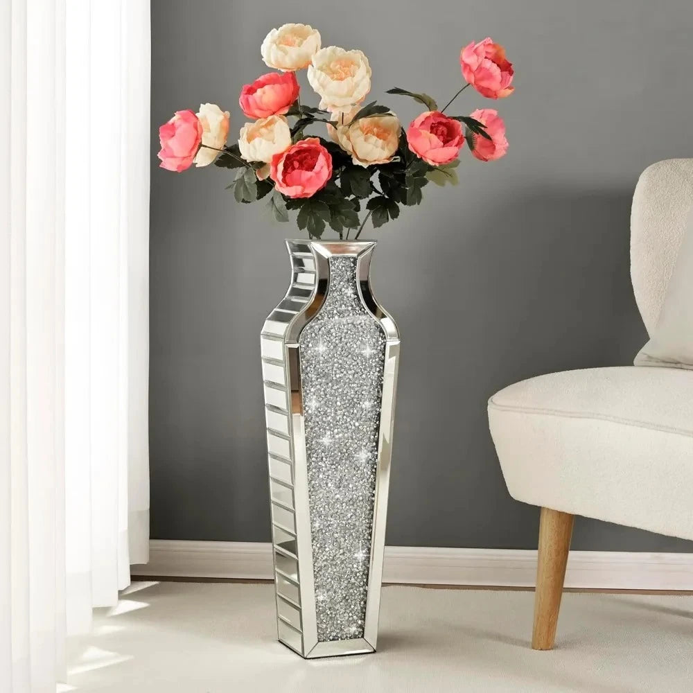 Silver Floor Vase on a white surfac with pink roses inside