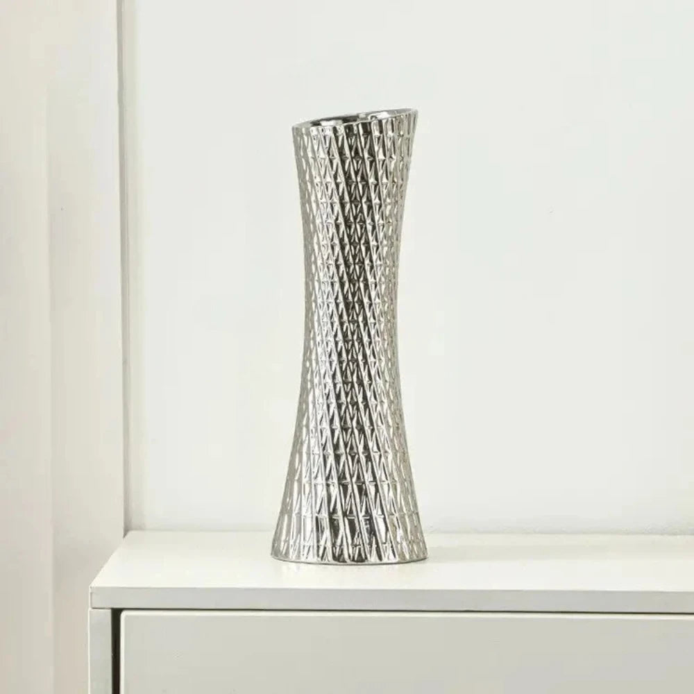 Silver Modern Vase on a white shelf 