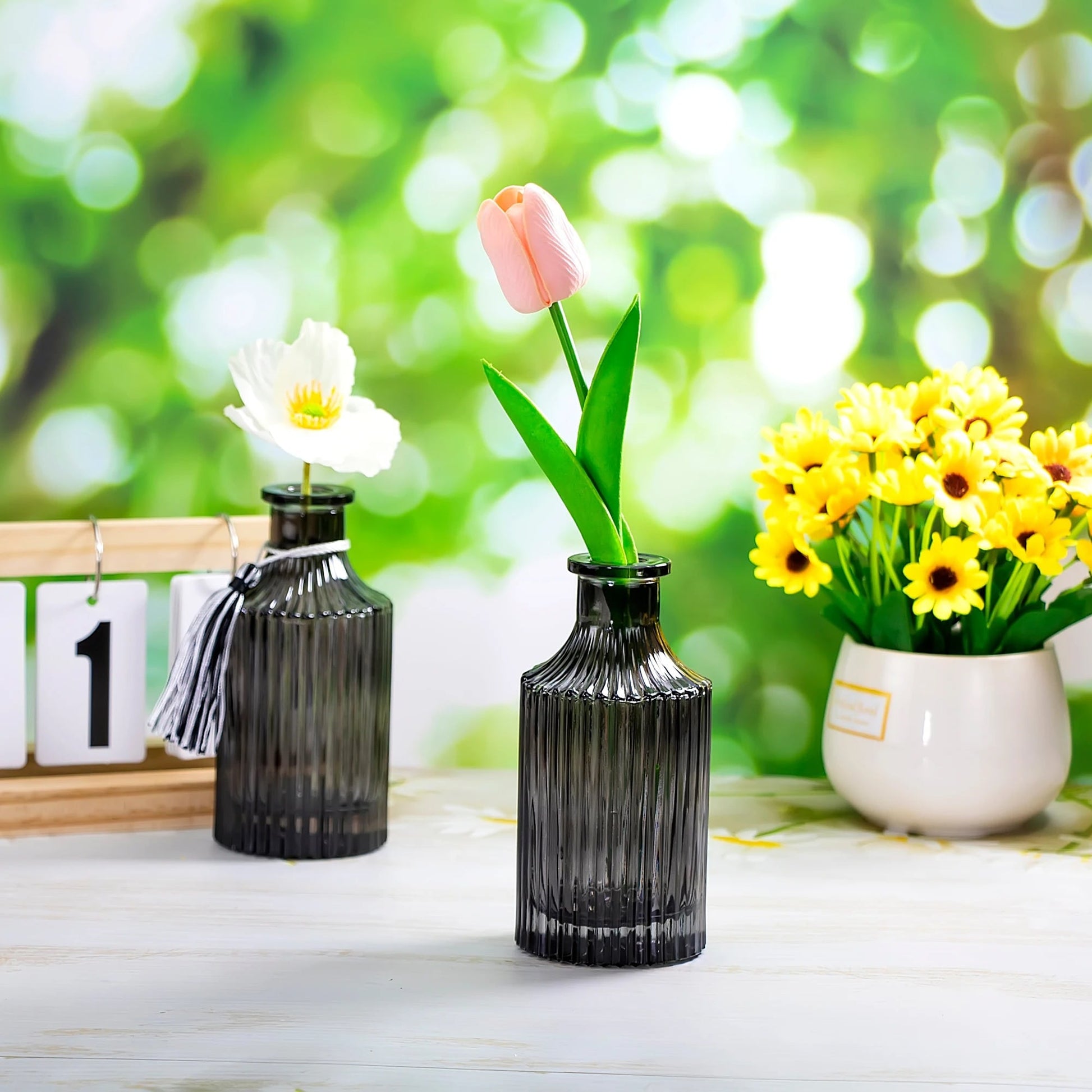 Two Small Black Vases With Tulip Inside