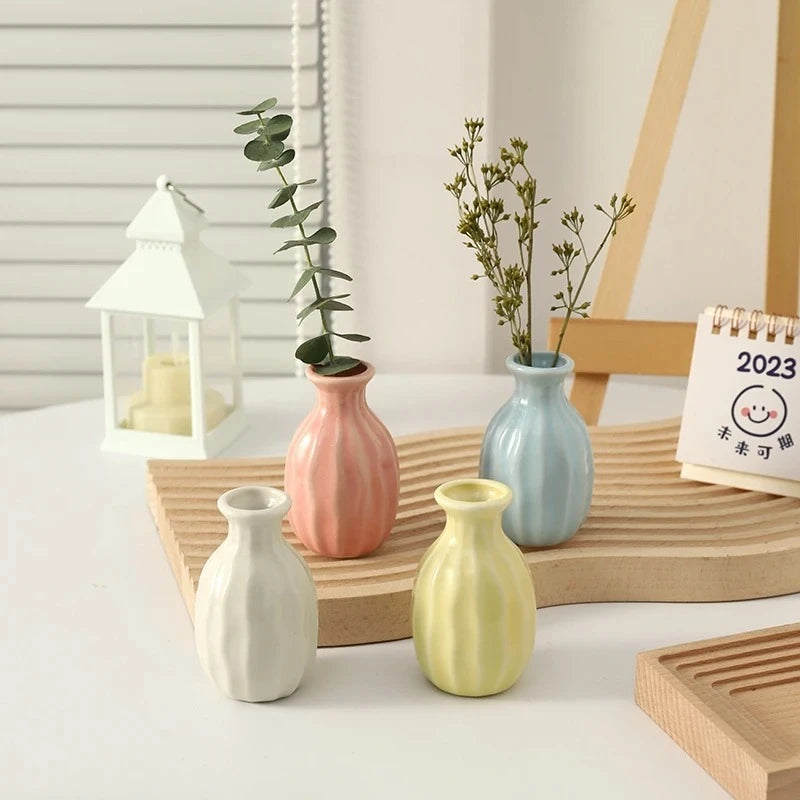 Four Small Vases on a wooden tray 