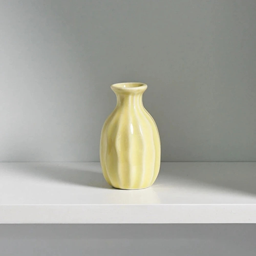 Yellow Small Vase on a white surface