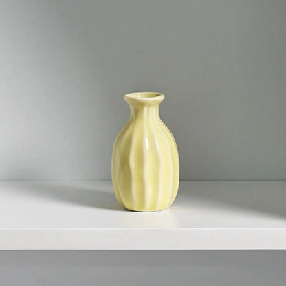 Yellow Small Vase on a white surface