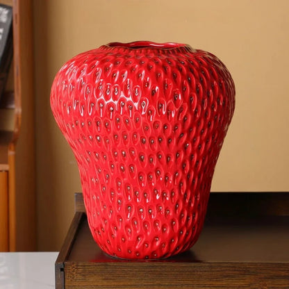 Red Strawberry Vase on a wooden shelf