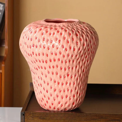 Pink Strawberry Vase on a wooden shelf