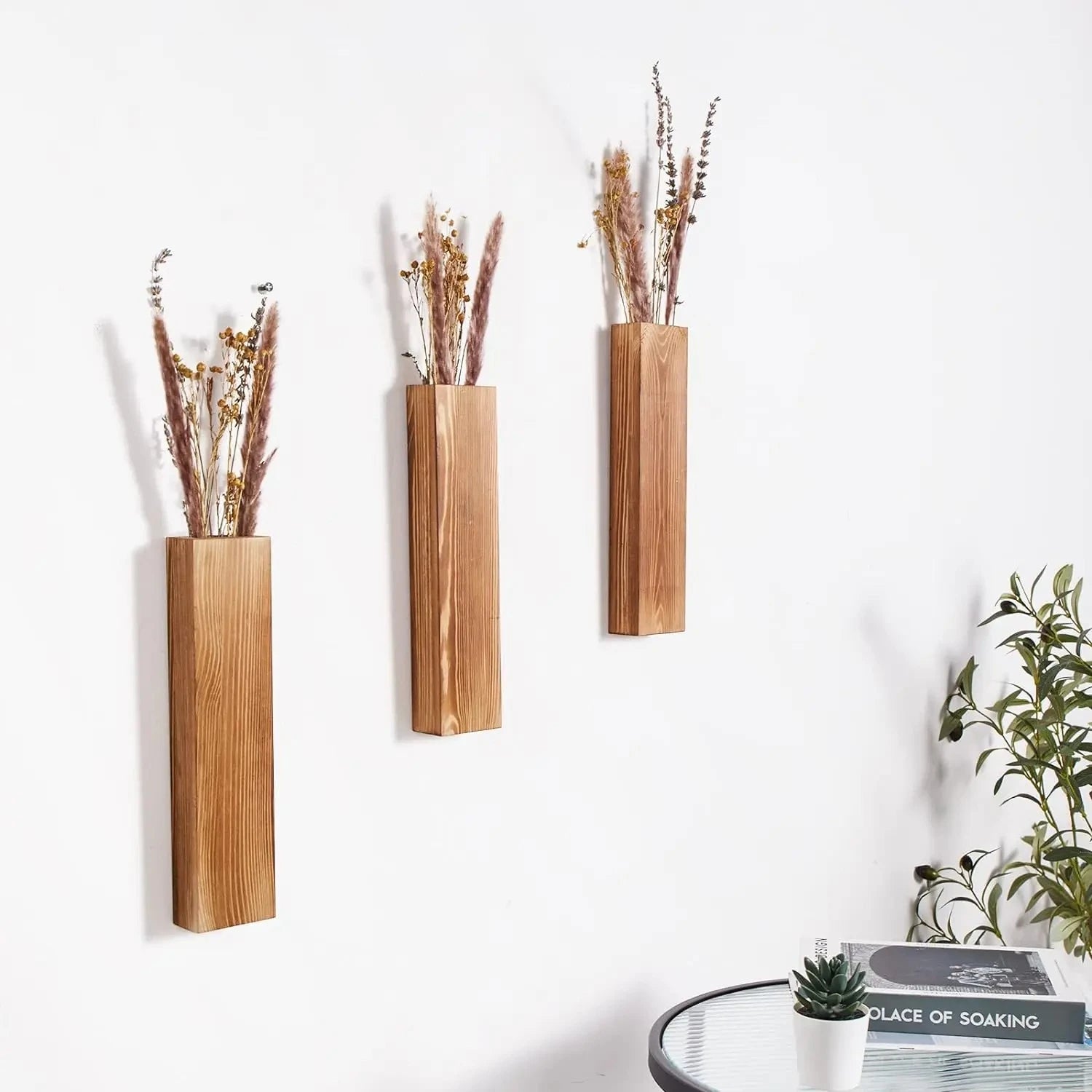 Three Wall Vases installed on a white wall