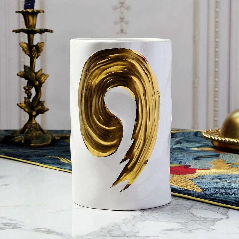 White Cylinder Vase on a white marble table