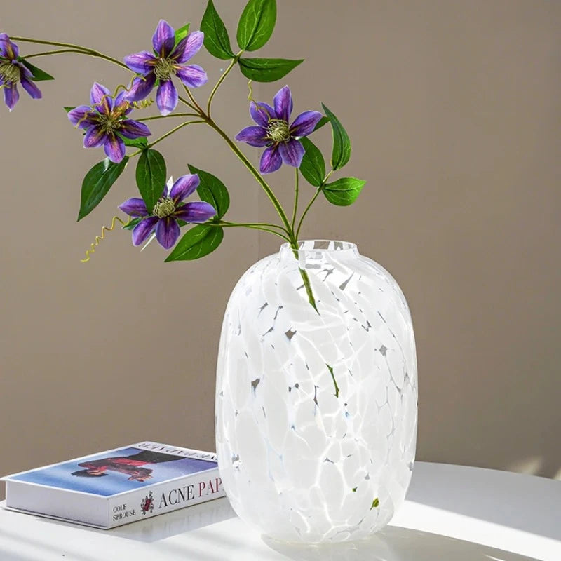 Large White Glass Vase with a purple flower inside