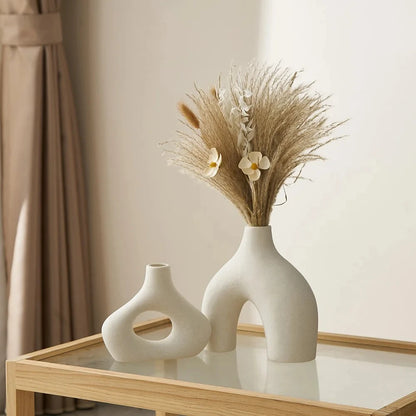 White Round Vases on a glass table 