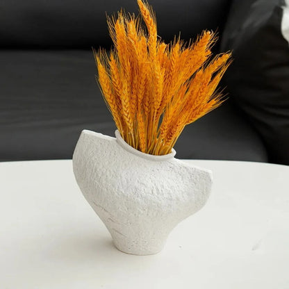 Medium White Textured Vase on a coffee table with orange decoration inside