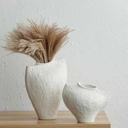 White Textured Vase on a wooden shelf with brown fern inside