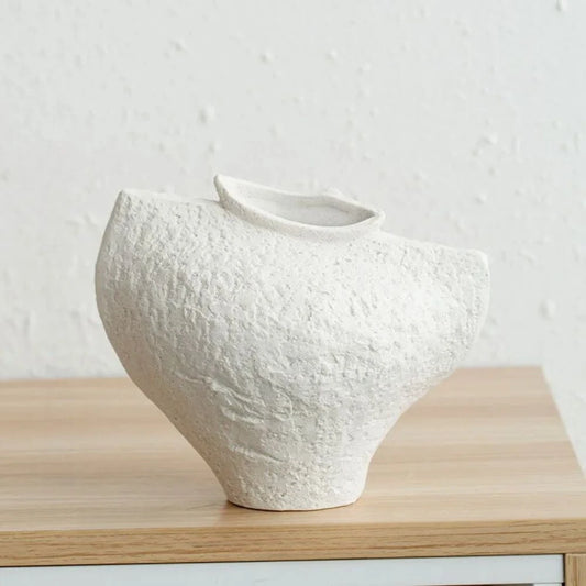 White Textured Vase on a wooden shelf