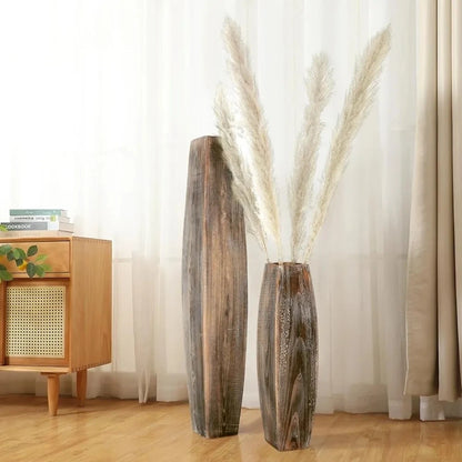 Two Wood Floor Vases on a wooden floor next to a dresser