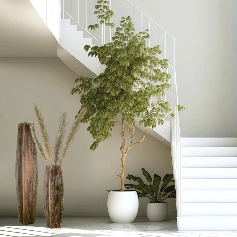 Two Wood Floor Vases underneath a staircase next to a green tree