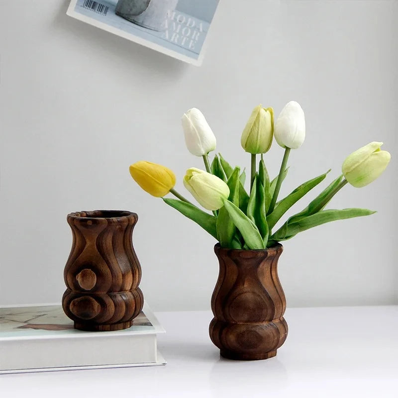 Two Wood Vases with yellow tulips inside